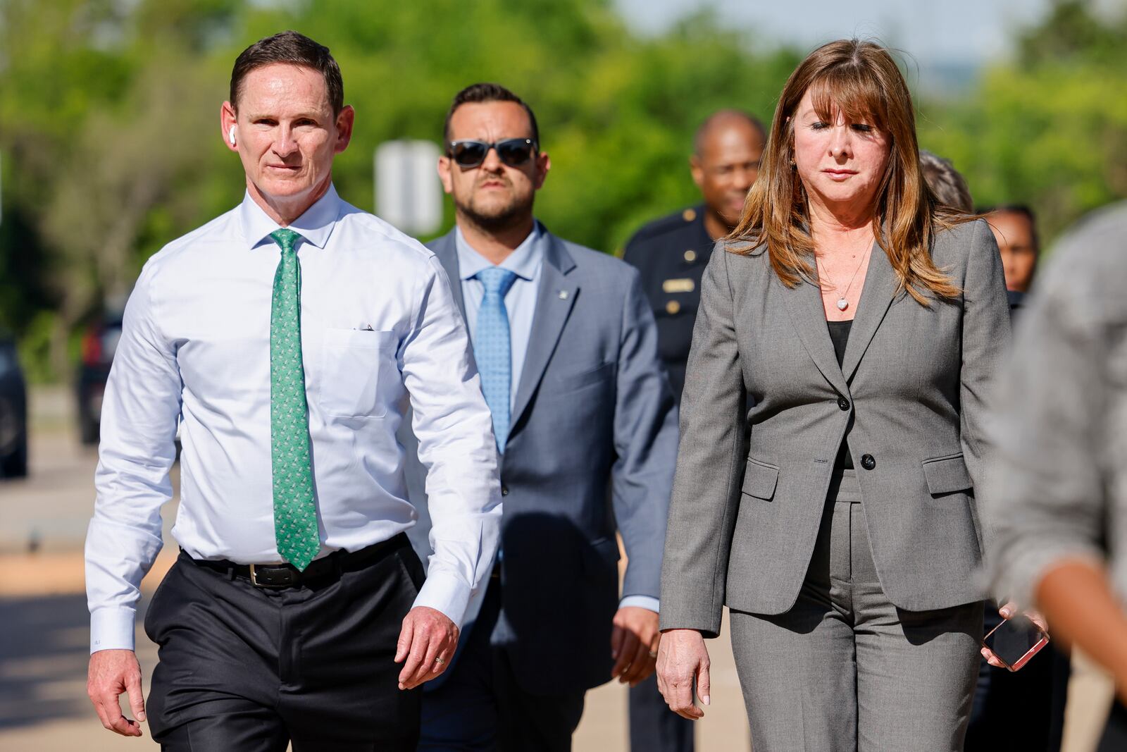 Dallas County Judge Clay Lewis Jenkins, left, and Dallas ISD Superintendent Stephanie Elizalde walk to address members of the media after a shooting at Wilmer-Hutchins High School, Tuesday, April 15, 2025, in Dallas. (Elías Valverde II/The Dallas Morning News via AP)