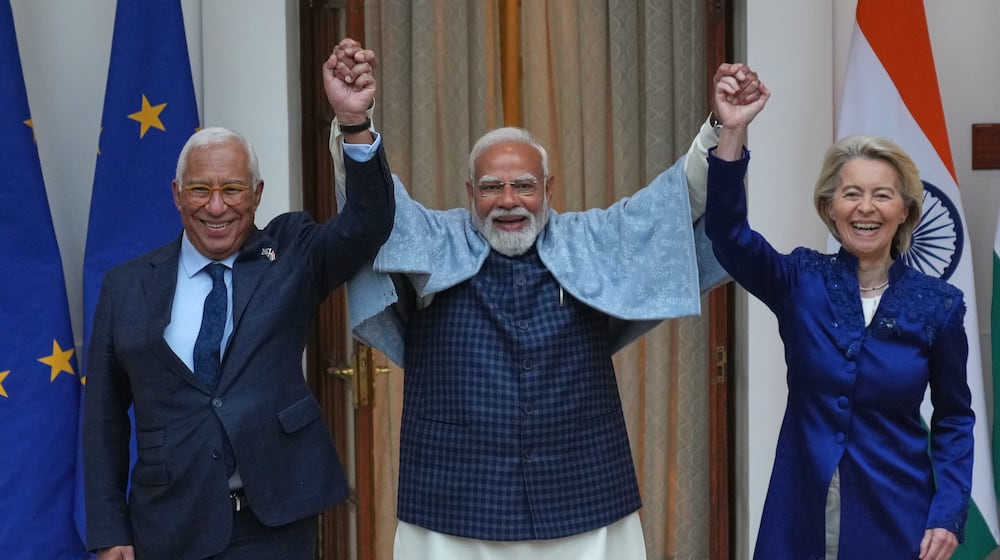 Indian Prime Minister Narendra Modi, center, welcomes European Council President Antonio Costa, left and European Commission President Ursula von der Leyen before their meeting in New Delhi, India, Tuesday, Jan. 27,2026. (AP Photo/Manish Swarup)