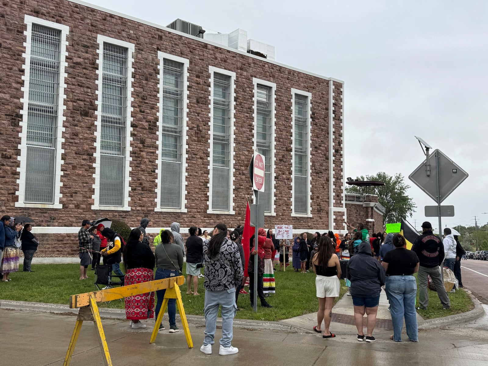 Protestors gather outside the South Dakota State Penitentiary on Friday, May 23, 2025 to protest about recent prison deaths. (AP Photo/Sarah Raza)