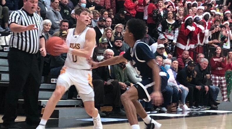 Centerville's Gabe Cupps looks to make a pass during Tuesday night's game vs. Fairmont. Jeff Gilbert/CONTRIBUTED