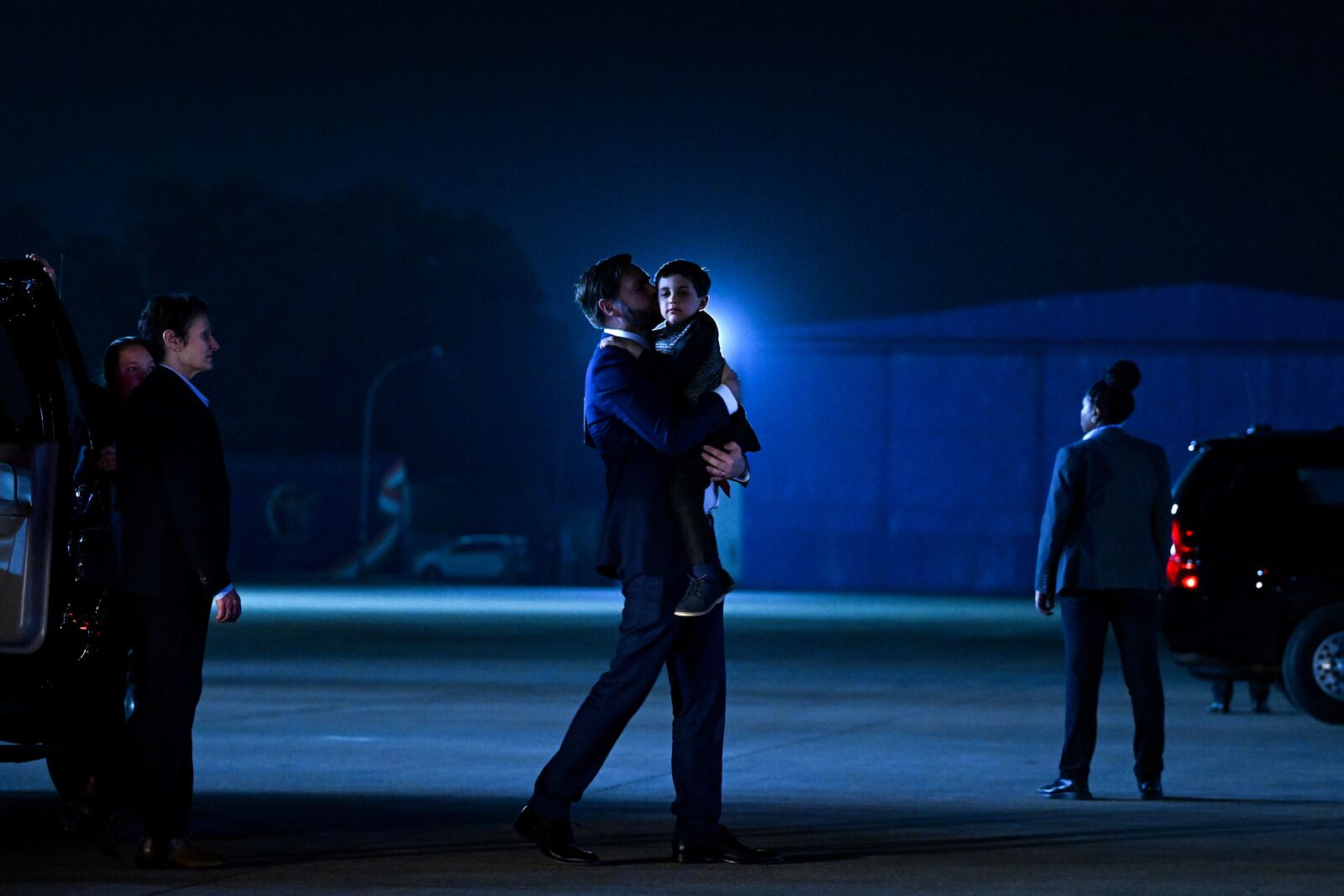 U.S. Vice President JD Vance carries his son Vivek across the tarmac to board Air Force Two en route to Jaipur, India, after spending the day in New Delhi, Monday, April 21, 2025. (Kenny Holston/The New York Times via AP, Pool)