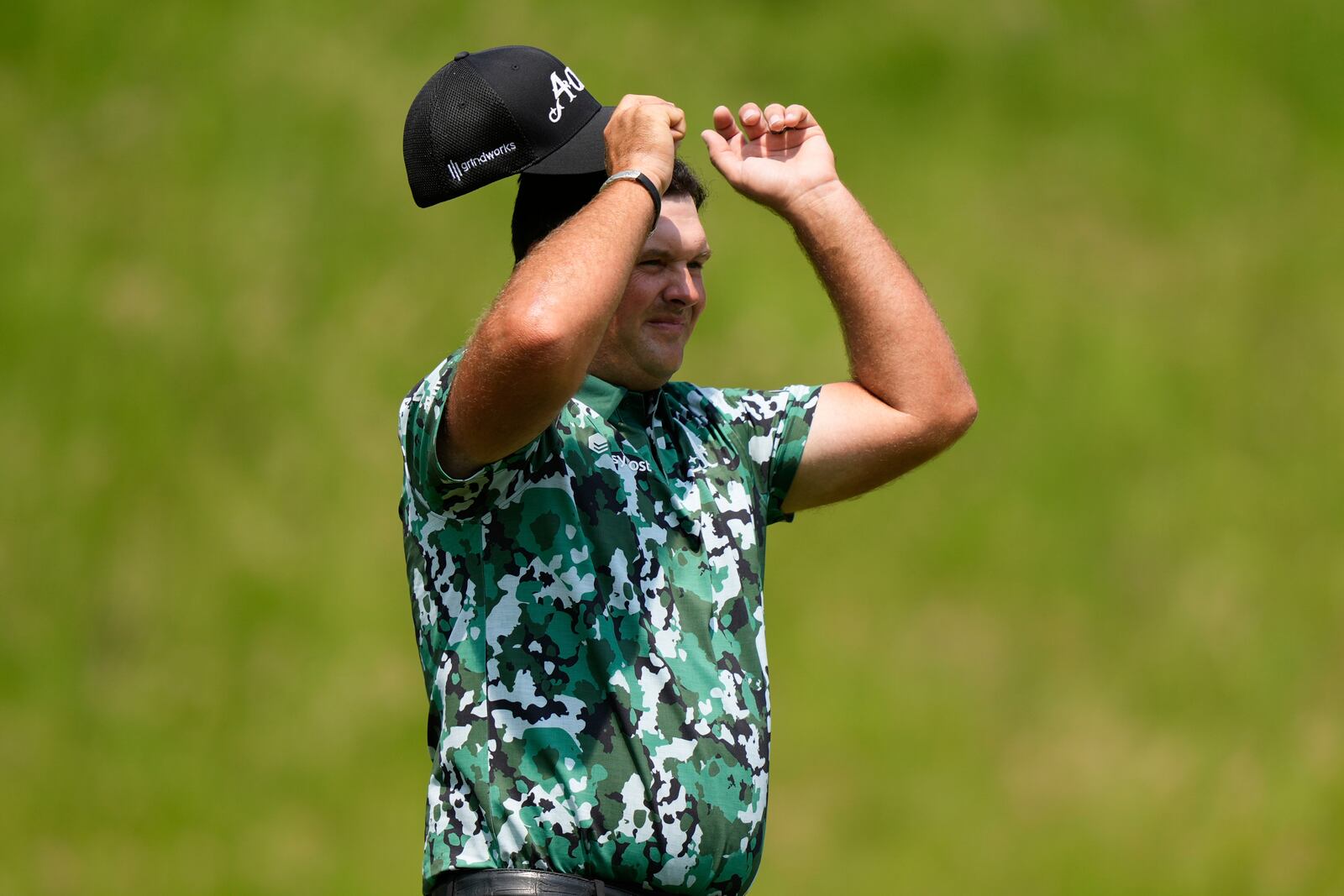 Patrick Reed walks after teeing off on the seventh hole during the first round of the U.S. Open golf tournament at Oakmont Country Club Thursday, June 12, 2025, in Oakmont, Pa. (AP Photo/Charlie Riedel)