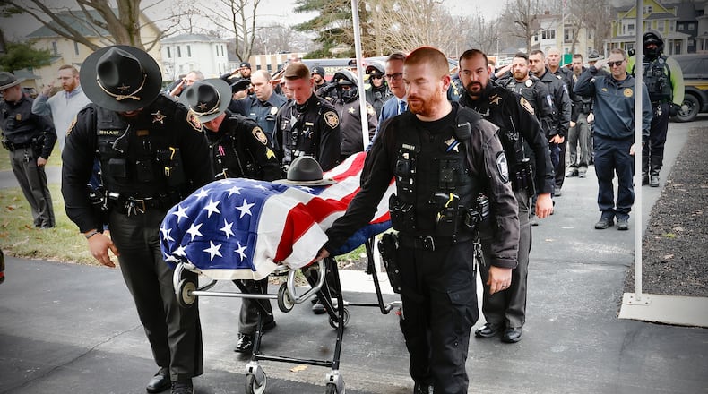 Members of the Clark County Sheriff's Department and other law enforcement officers bring the body of Summer E. Jenkins into the Littleton and Rue Funeral Home in Springfield on Thursday, Dec. 19, 2024. MARSHALL GORBY\STAFF