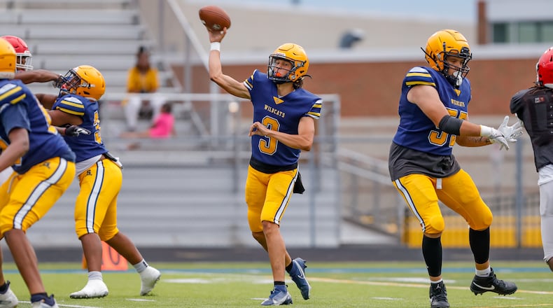 Springfield High School senior quarterback Brent Upshaw throws a pass during their scrimmage game against Cincinnati Princeton on Thursday, Aug. 15 in Springfield. Michael Cooper/CONTRIBUTED