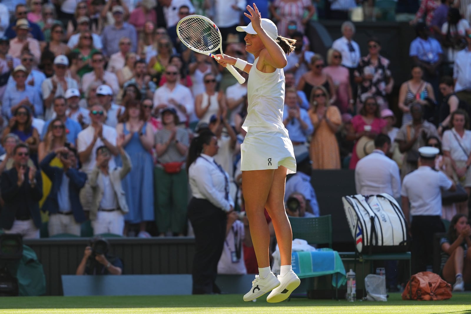 Iga Swiatek of Poland celebrates winning the women's singles semifinal match against Belinda Bencic of Switzerland at the Wimbledon Tennis Championships in London, Thursday, July 10, 2025.(AP Photo/Kirsty Wigglesworth)