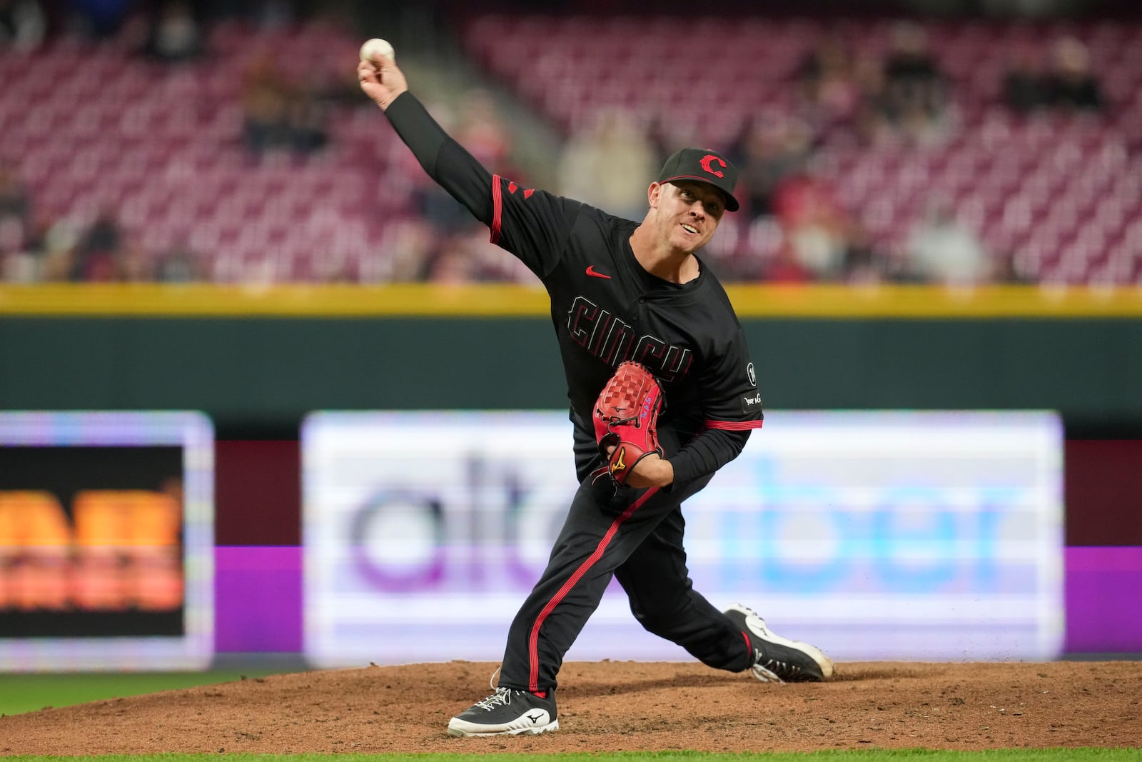 Cincinnati Reds pitcher Emilio Pagán throws during the ninth inning of a baseball game against the Pittsburgh Pirates, Friday, April 11, 2025, in Cincinnati. (AP Photo/Jeff Dean)