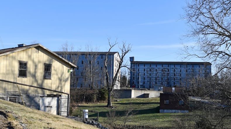 FILE - Bourbon barrel rack houses sit on a hillside at the Four Roses Distillery in Lawrenceburg, Ky., Monday, Feb. 3, 2025. (AP Photo/Timothy D. Easley).