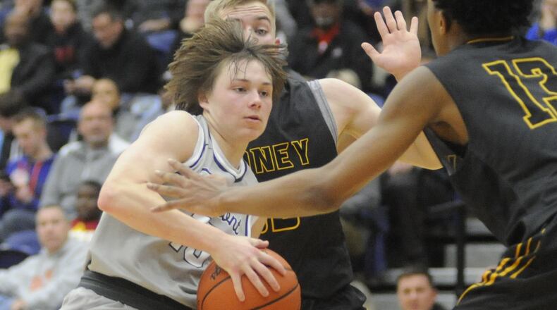 Fairmont’s Jack Hendricks (with ball) is met by Sidney defenders Chris Lee (middle) and Ratez Roberts. Fairmont defeated Sidney 60-51 in the 15th annual Premier Health Flyin’ to the Hoop opener at Kettering’s Trent Arena on Friday, Jan. 13, 2017. MARC PENDLETON / STAFF