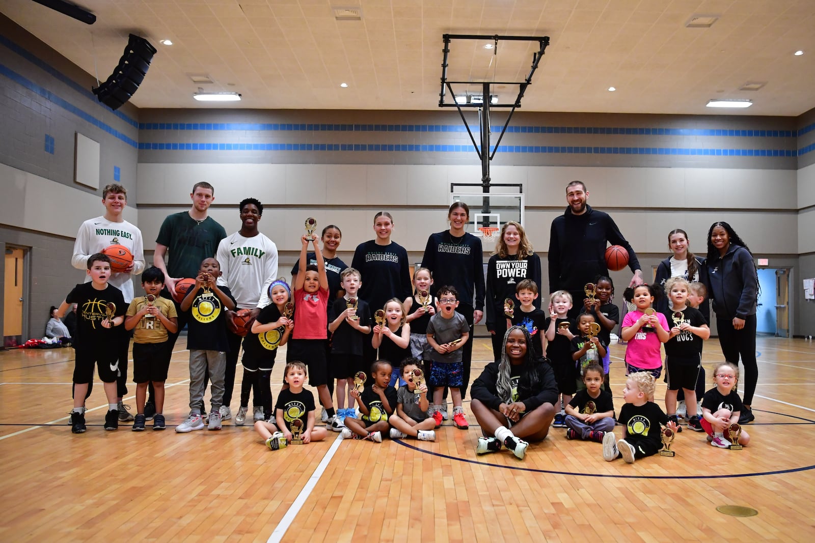 Members of the Bitty Ballers basketball camp pose with instructors, including Wright State basketball players, in 2025. Contributed photo