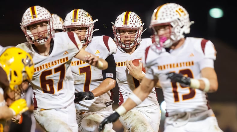 Northeastern High School senior Cody Houseman runs behind a group of blockers during their game at West Jefferson on Friday, Sept. 26 at Kile Field. MICHAEL COOPER / STAFF