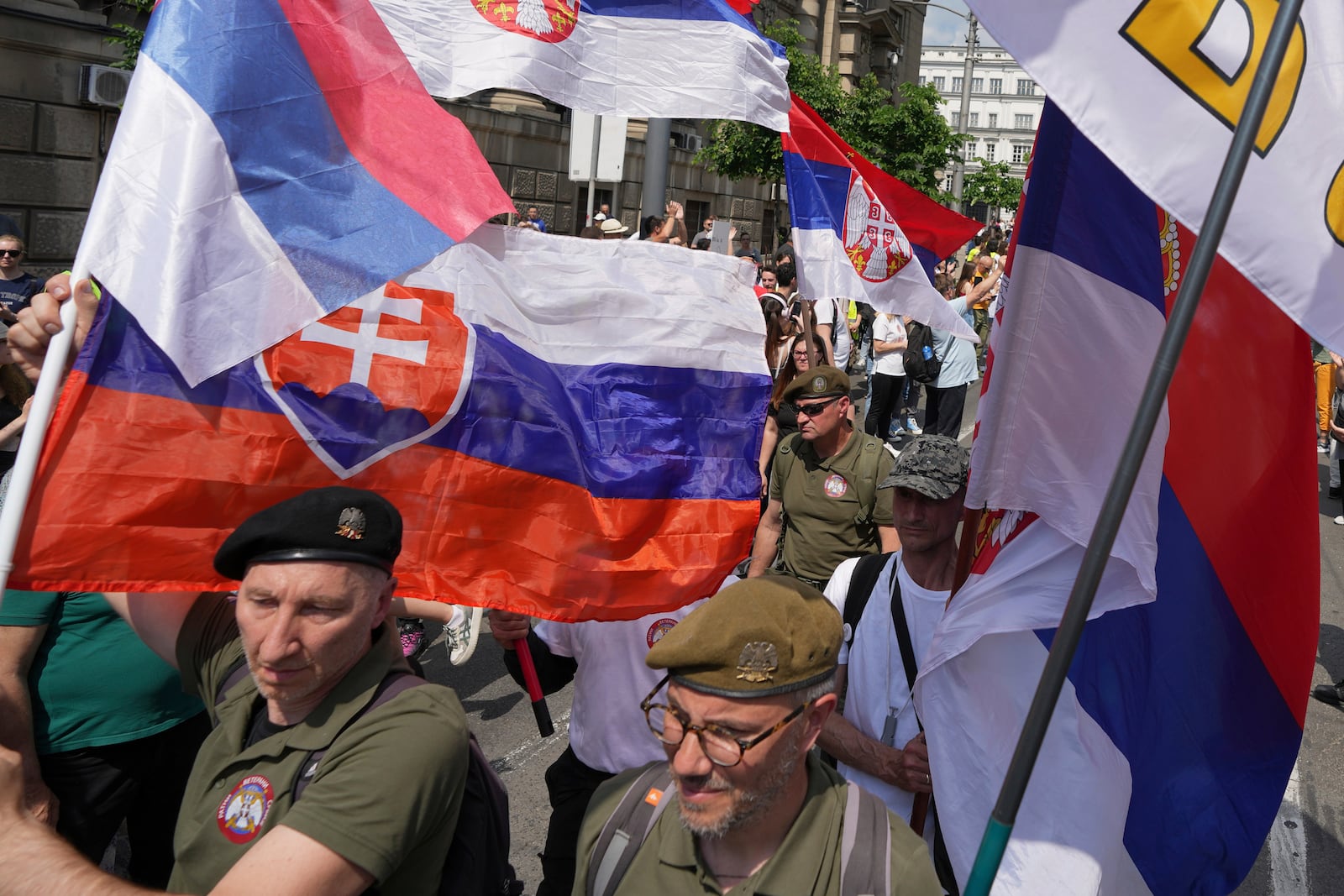 Military veterans protest in front of the government building, six months after the deadly train station tragedy that sparked mass demonstrations against corruption, in Belgrade, Serbia, Thursday, May 1, 2025. (AP Photo/Darko Vojinovic)
