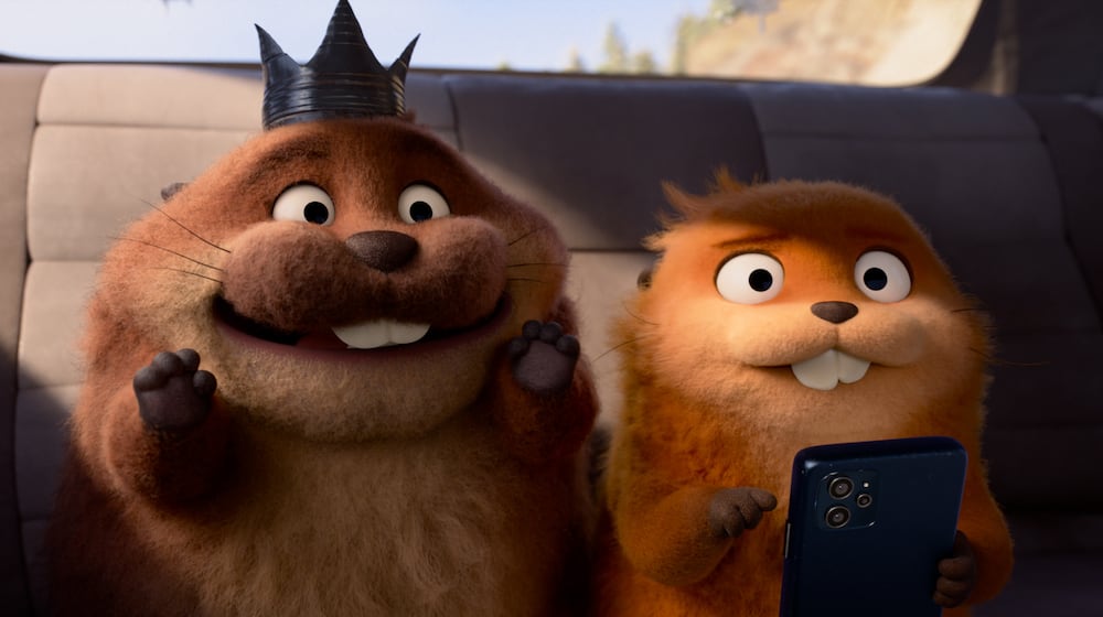 This image released by Disney shows Mabel Beaver, voiced by Piper Curda, right, and King George, voiced by Bobby Moynihan in a scene from the animated film "Hoppers." (Disney/Pixar via AP)