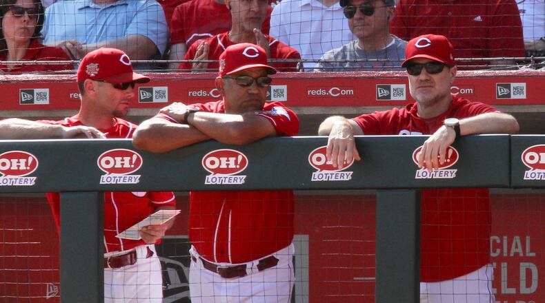 Reds manager David Bell, right, watches the final home game of the season on Thursday, Sept. 26, 2019, at Great American Ball Park in Cincinnati.