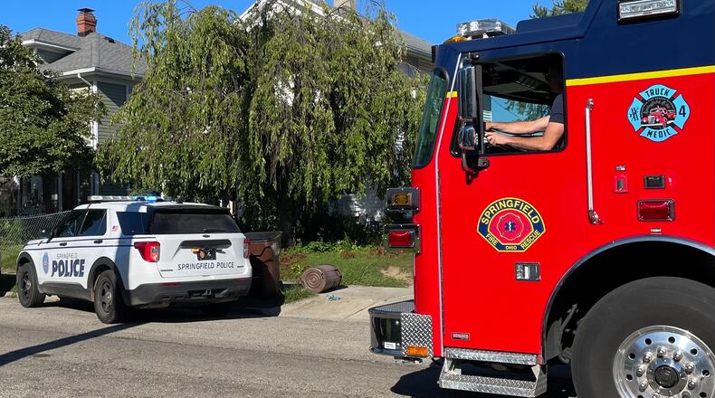 Springfield police and fire personnel were on the scene at a house in the 200 block of North Clairmont Avenue where a 2-year-old boy was found in a backyard pool Thursday, Aug. 31, 2023. BILL LACKEY/STAFF