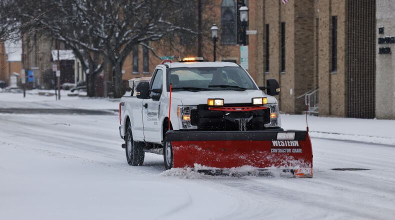 City crews work to clear snow on the streets of Middletown, Jan. 17, 2022. NICK GRAHAM/STAFF