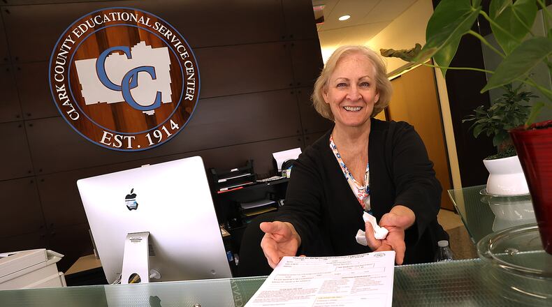 Risa Elrod, a substitute teacher since 2014, shows the form new substitutes have to fill out for a background check when they come into the Clark County ESC Tuesday. BILL LACKEY/STAFF