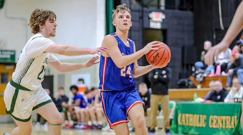 Greeneview High School junior Will Climie drives past Catholic Central senior Ben Bramel during their game on Friday night at Jason Collier Gymnasium in Springfield. MICHAEL COOPER/CONTRIBUTED