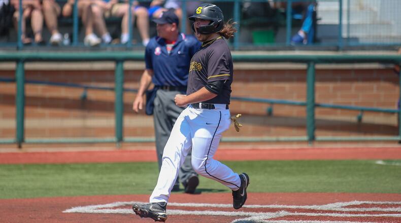 Cutline: Shawnee High School's Michael Moore celebrates after scoring a run during their game against Cincinnati Hills Christian Academy on Friday at Wright State University's Nischwitz Stadium. The Eagles won 5-2. CONTRIBUTED PHOTO BY MICHAEL COOPER