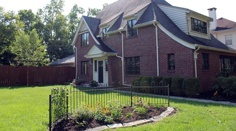 The 3-bedroom home combines original charm with an open concept floor plan. It has about 1,940 sq. ft. of living space, with 4 bedrooms and a 2-car garage. CONTRIBUTED PHOTO