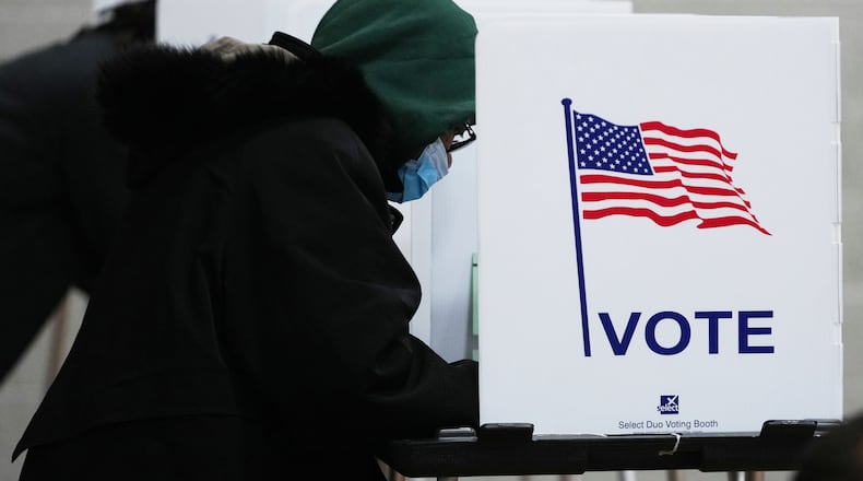 Voters fill out their ballot on Election Day, Tuesday, Nov. 4, 2025, in Detroit. (AP Photo/Paul Sancya)