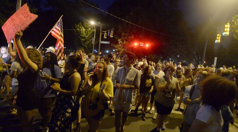 CHAPEL HILL, NC - AUGUST 22: Demonstrators attempt to march the streets but are turned away back toward campus to rally for the removal of a Confederate statue coined Silent Sam on the campus of the University of Chapel Hill on August 22, 2017 in Chapel Hill North Carolina. The city Mayor asked the university president to take proper means to remove the statue. (Photo by Sara D. Davis/Getty Images)