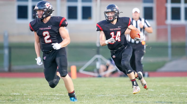 Tecumseh High School junior Tim Moore, Jr. (14) runs the ball during their game against Carroll on Friday, Aug. 26, 2022 at Spitzer Stadium in New Carlisle. The Arrows won 35-3. CONTRIBUTED PHOTO BY MICHAEL COOPER