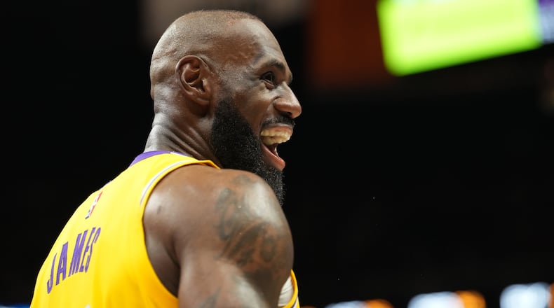 Los Angeles Lakers forward LeBron James smiles during the second half of an NBA basketball game against the Miami Heat, Thursday, March 19, 2026, in Miami. (AP Photo/Lynne Sladky)