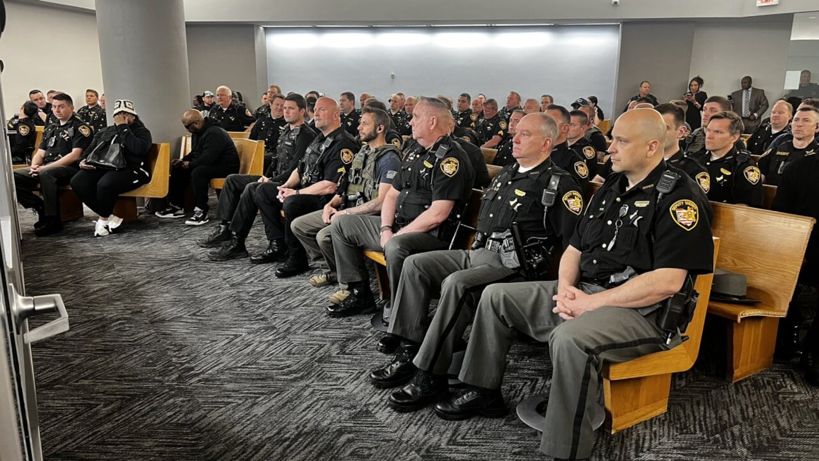 Officers and friends and family attend Rodney Hinton Jr.'s bond hearing. WCPO/CONTRIBUTED