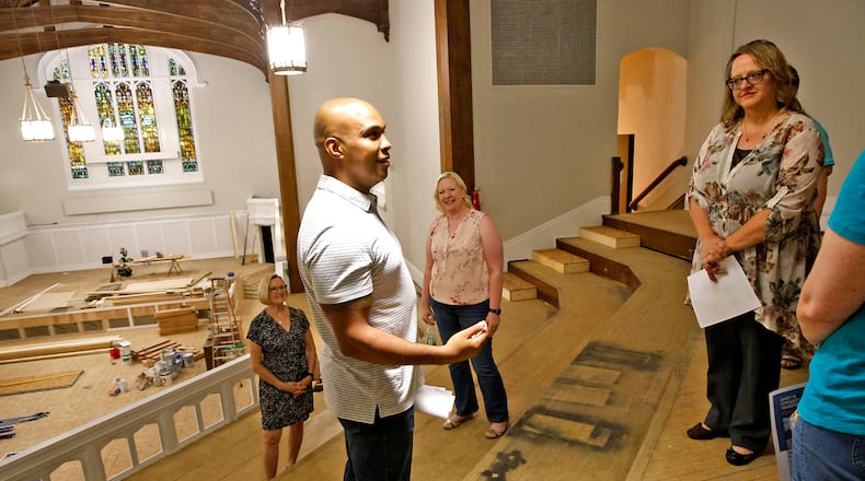 The Nehemiah Foundation's Amy Willmann, right, listens to Levi Duncan talk about The Metropolis Friday, June 21, 2024 during a tour of their new facilities. BILL LACKEY/STAFF