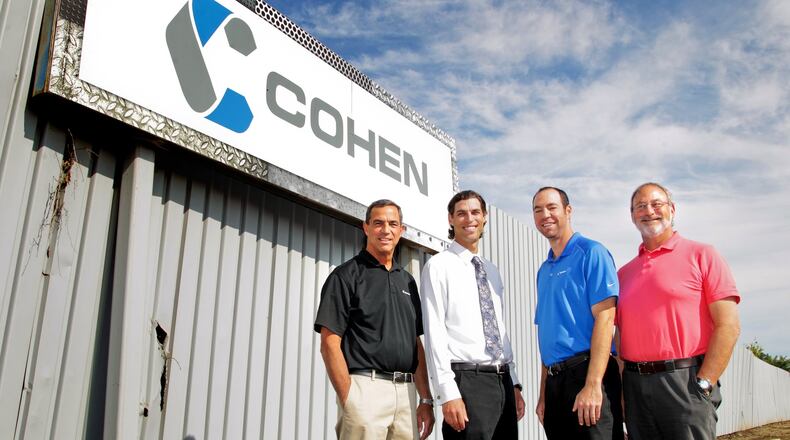 From left, Ken Cohen, Andy Cohen, Adam Dumes and Neil Cohen stand outside Cohen Recycling in Middletown Thursday, Aug. 15, 2013. NICK DAGGY / STAFF