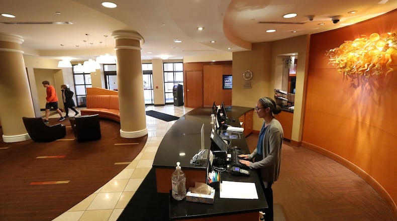Kylah Smith works at the front desk at the Courtyard by Marriott in Springfield. BILL LACKEY/STAFF