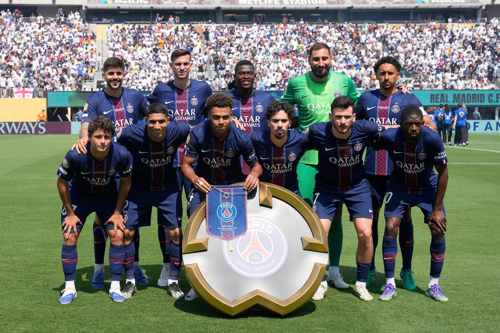 Paris Saint-Germain's starting 11 pose for a team photo before the Club World Cup semifinal soccer match between PSG and Real Madrid in East Rutherford, N.J., Wednesday, July 9, 2025. (AP Photo/Seth Wenig)