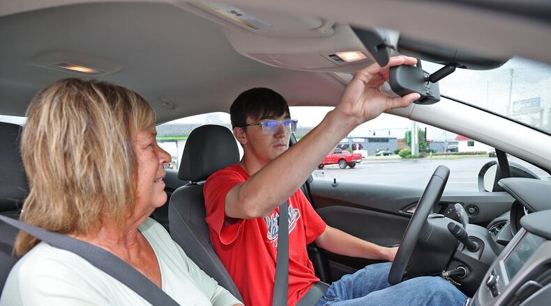 Driving instructor Linda Schetter, from the Springfield School of Driving, gives Jacob Moore a driving lesson Wednesday. BILL LACKEY/STAFF