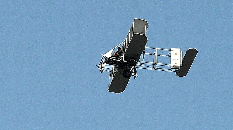 A replica of a Wright B Flyer flies over Hawthorn Hill Monday, Sept. 18, 2023. MARSHALL GORBY\STAFF