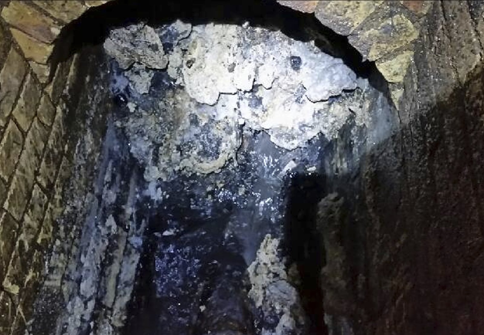 This file photo from Thames Water shows a "fatberg" inside a sewer in London. Engineers worldwide are fighting fat blobs that clog sewers and are hard to dissolve. (Thames Water via AP)