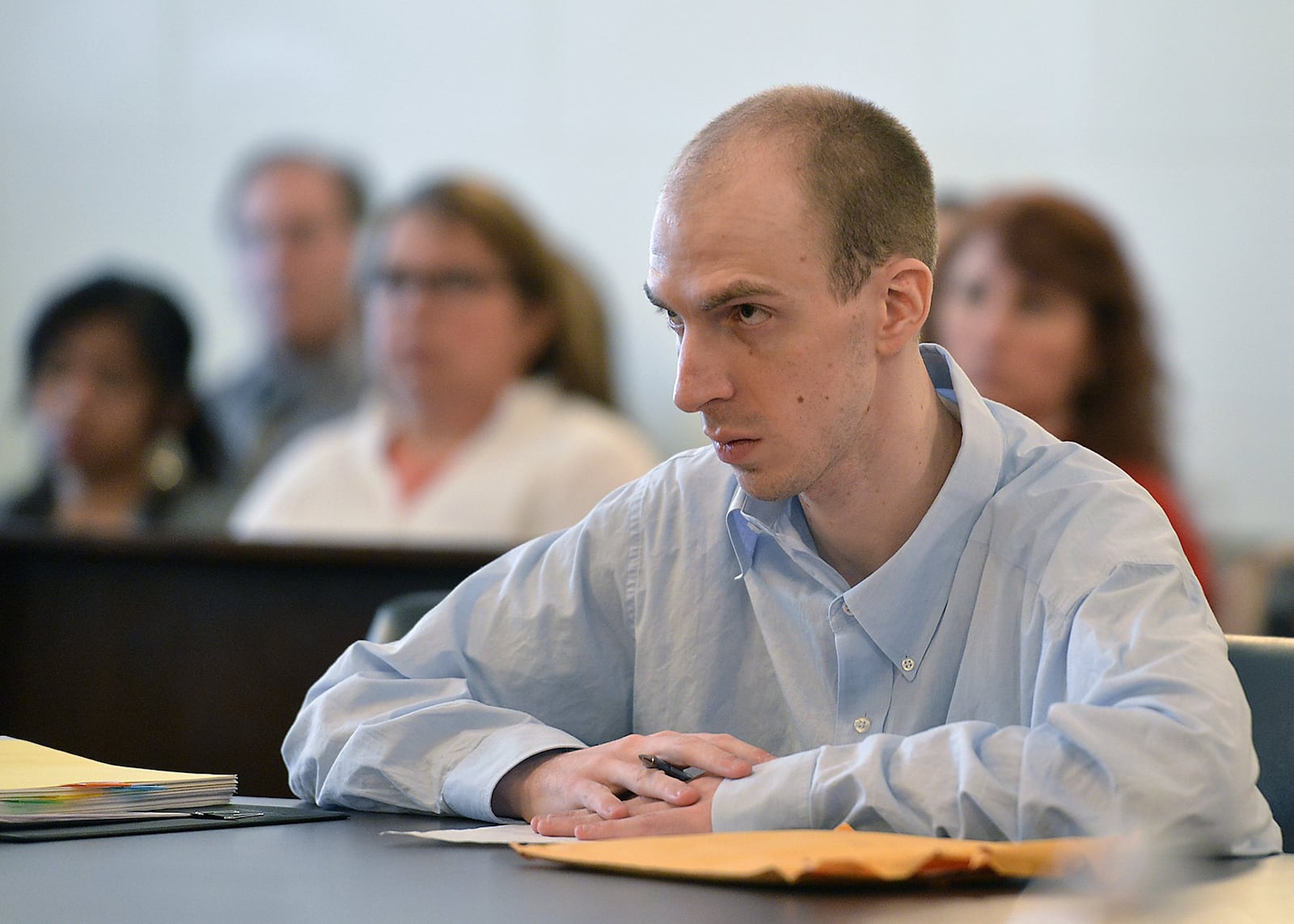 Ryan Dillon stands trial in Clark County Common Pleas Court on Monday, accused of killing his mother and fleeing in a stolen truck to Wisconsin nearly two years ago. Bill Lackey/Staff