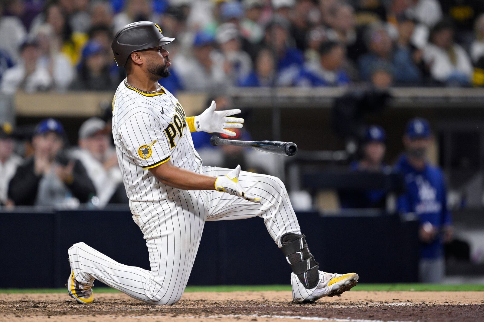 San Diego Padres' Elias Diaz reacts after striking out during the ninth inning of a baseball game against the Los Angeles Dodgers Monday, June 9, 2025, in San Diego. (AP Photo/Orlando Ramirez)