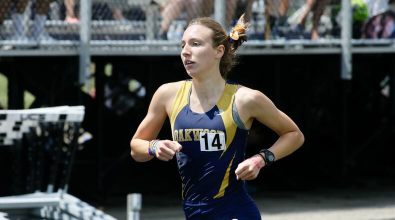 Oakwood's Grace Hartman runs to victory in the 1,600-meter run at the Division II state track and field team championship on Saturday, June 5, 2021, at Pickerington North High School. David Jablonski/Staff