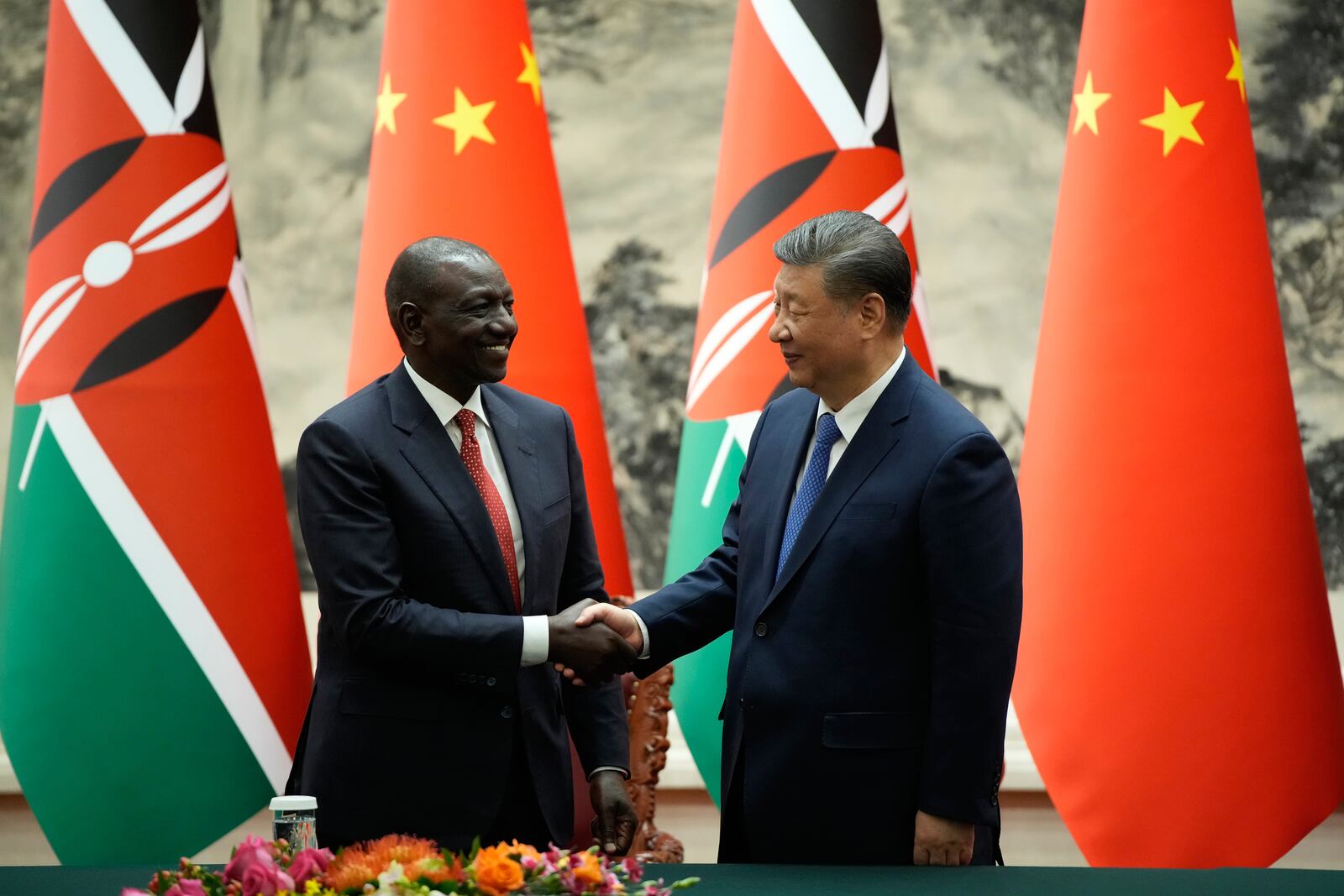Chinese President Xi Jinping, right, and Kenyan President William Ruto shake hands during a signing ceremony at the Great Hall of the People in Beijing Thursday, April 24, 2025. (Iori Sagisawa/Pool Photo via AP)