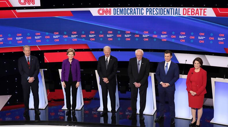 From left, Tom Steyer, Sen. Elizabeth Warren (D-Mass.), former Vice President Joe Biden, Sen. Bernie Sanders (I-Vt.), former South Bend, Ind., Mayor Pete Buttigieg, and Sen. Amy Klobuchar (D-Minn.) await the start of the Democratic presidential primary debate at Drake University in Des Moines, Iowa, on Tuesday, Jan. 14, 2020. According to a Monmouth University poll released today, Iowa is still up for grabs. (Scott Olson/Getty Images/TNS)