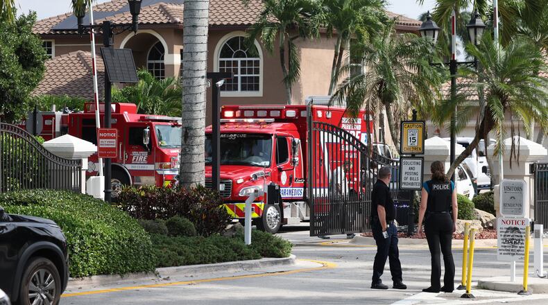 Emergency personnel from Coral Springs and Coconut Creek are on scene where a plane crashed in the Windsor Bay community in Coral Springs on Monday, Nov. 10, 2025. (Carline Jean/South Florida Sun-Sentinel via AP)
