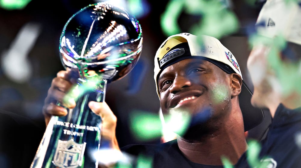 Seattle Seahawks running back Kenneth Walker III holds the Lombardi trophy after the Seahawks defeated the New England Patriots in the Super Bowl 60 in Santa Clara, Calif., Sunday, Feb. 8, 2026. (Scott Strazzante/San Francisco Chronicle via AP)