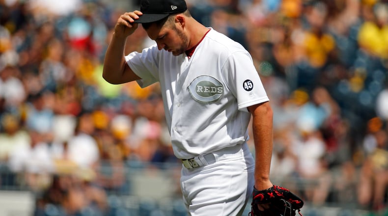 PITTSBURGH, PA - AUGUST 25: Trevor Bauer #27 of the Cincinnati Reds reacts in the second inning against the Pittsburgh Pirates at PNC Park on August 25, 2019 in Pittsburgh, Pennsylvania. Teams are wearing special color schemed uniforms with players choosing nicknames to display for Players' Weekend. (Photo by Justin K. Aller/Getty Images)