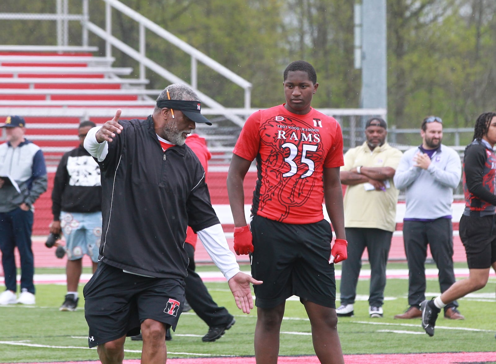 High school football recruiting showcase 2025: Trotwood-Madison coach Jeff Graham (left) and TE John Lumpkin III