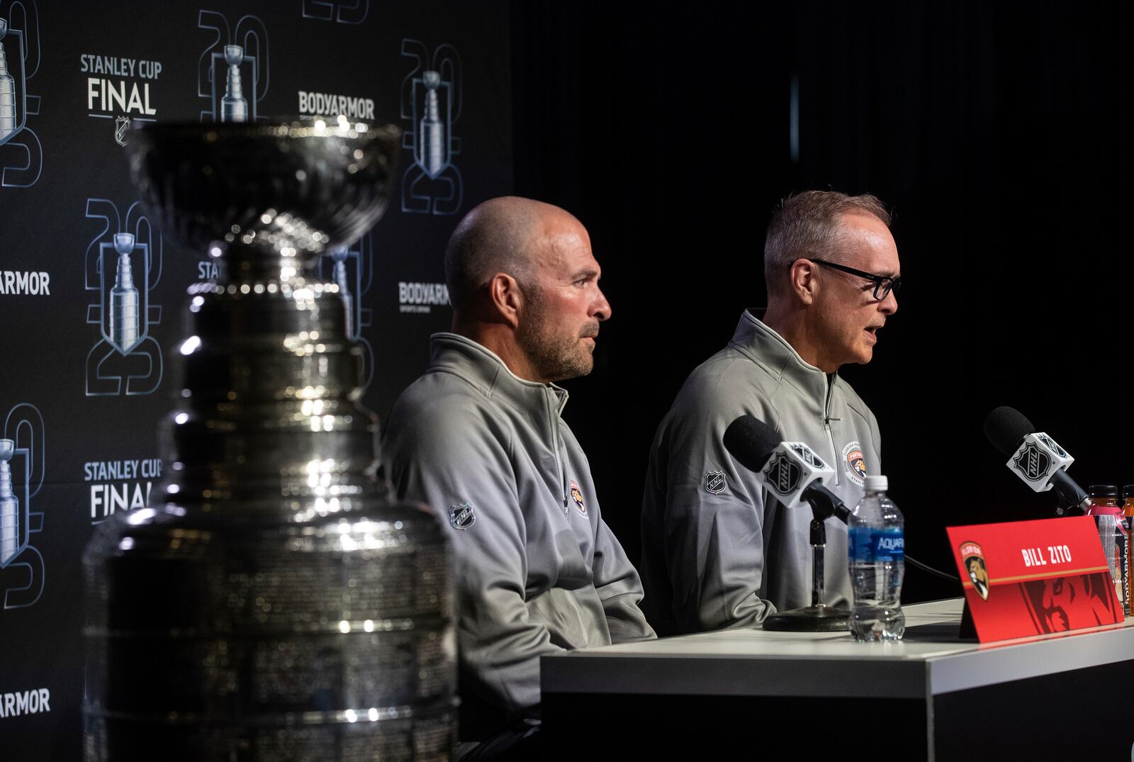 Florida Panthers' general manager Bill Zito, left, and head coach Paul Maurice speak to media during a news conference, Tuesday, June 3, 2025, in Edmonton, Alberta, ahead of Game 1 of the NHL hockey Stanley Cup final series against the Edmonton Oilers. (Jason Franson/The Canadian Press via AP)