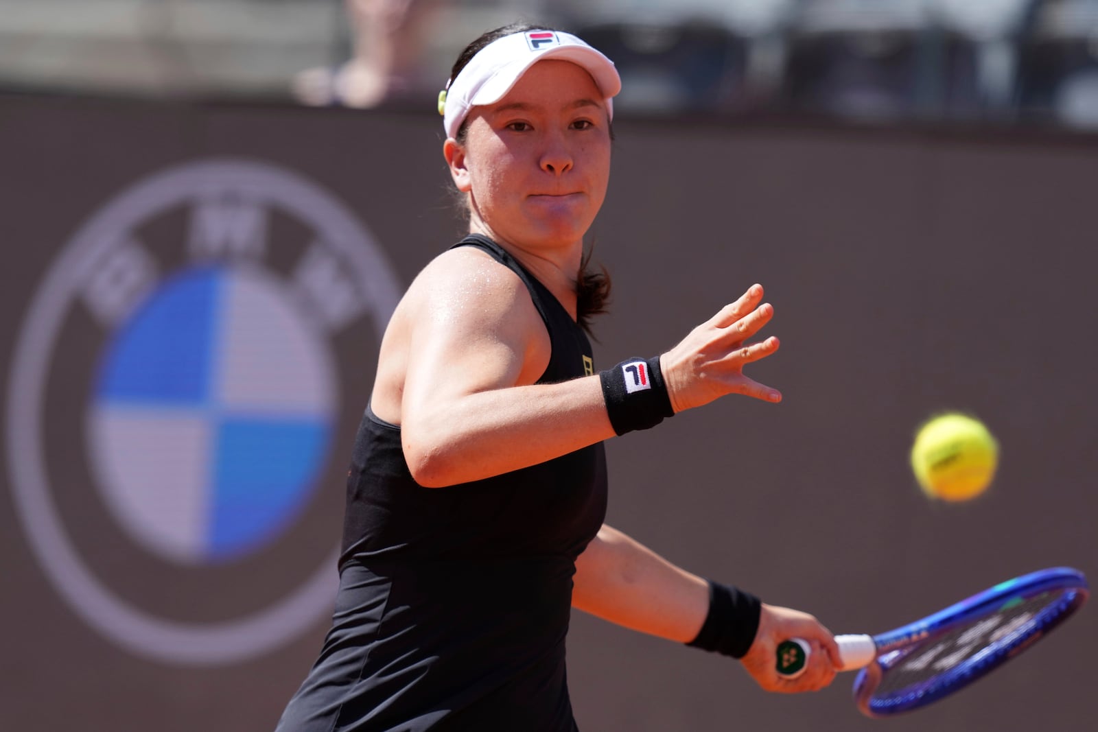 New Zealand's Lulu Sun plays a return to Italy's Jasmine Paolini during the 3rd round at the WTA Master 1000 Internazionali d'Italia tournament at Foro Italico in Rome, Italy, Thursday May 8, 2025 (Alfredo Falcone/LaPresse via AP)