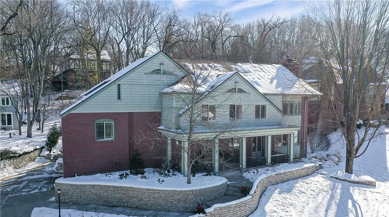 This two story brick and shingle home has been updated inside and out.