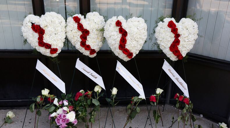 Memorials to the Dayton shooting victims and dozens of media workers filled the sidewalks of the Oregon District on Monday morning in the wake of ten people being killed, including the shooter, and more than two dozen injured at 1:00 A.M. on Sunday morning. TY GREENLEES / STAFF