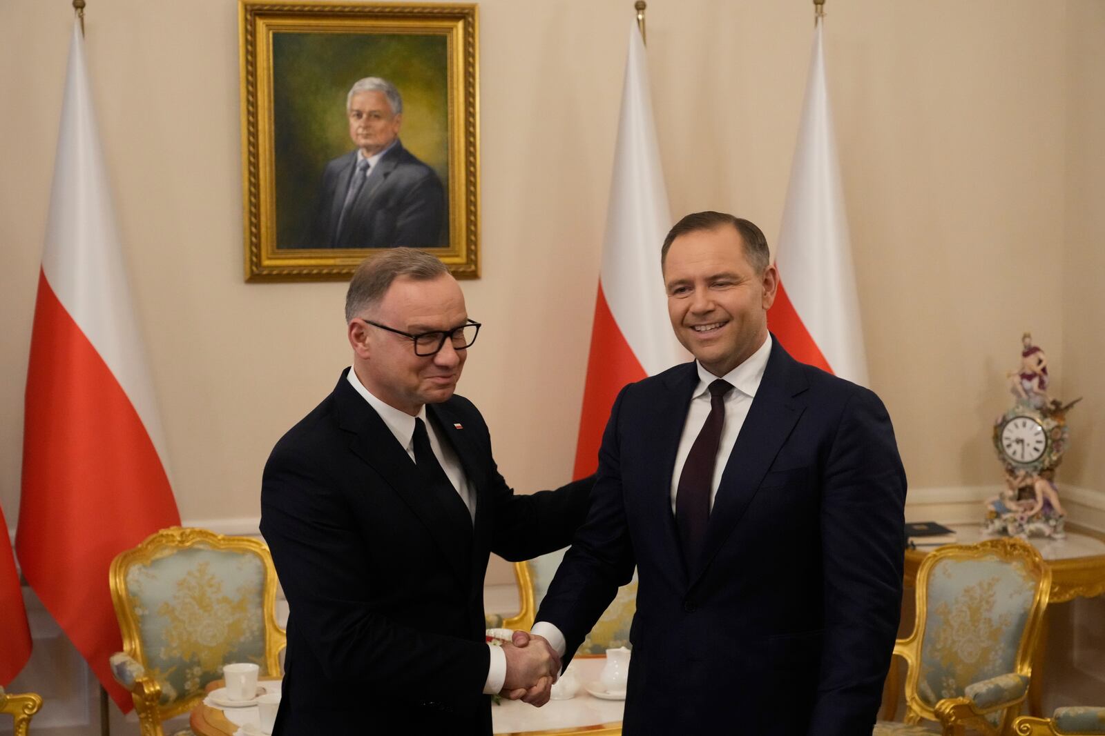 Poland's outgoing President Andrzej Duda, left, welcomes the President Elect Karol Nawrocki at the Presidential Palace in Warsaw, Poland, Tuesday, June 3, 2025. (AP Photo/Czarek Sokolowski)