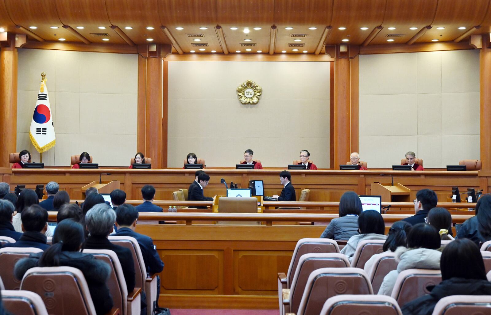 FILE - South Korea's Constitutional Court's judges, from left, Chung Kye-sun, Kim Bok-hyeong, Jung Jung-mi, Lee Mi-son, acting Chief Justice Moon Hyung-bae, Kim Hyung-du, Cheong Hyung-sik and Cho Han-chang sit for the first formal hearing of a trial on the validity of President Yoon Suk Yeol's impeachment by the National Assembly at the constitutional court of Korea in Seoul, South Korea, on Jan. 14, 2025. (Kim Min-Hee/Pool Photo via AP, File)
